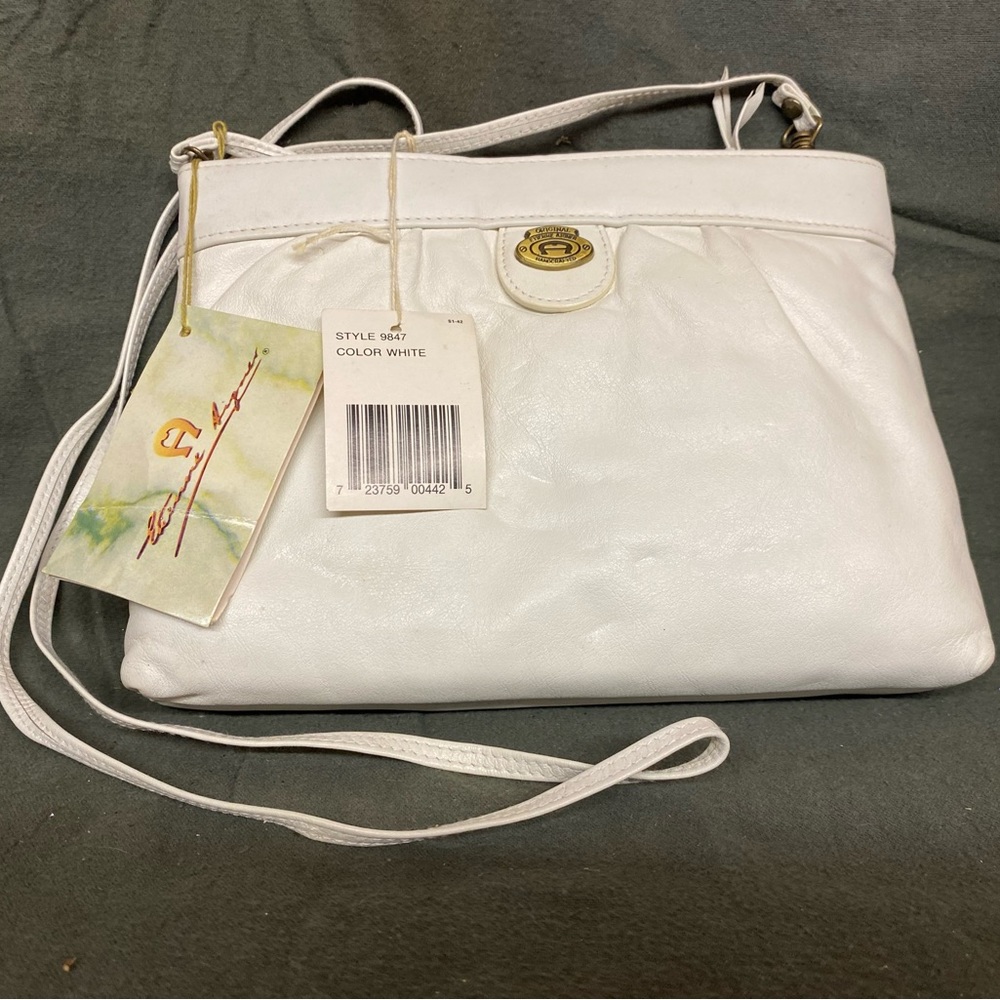 Etienne Aigner Leather Crossbody bag with 46 inch strap. White in color